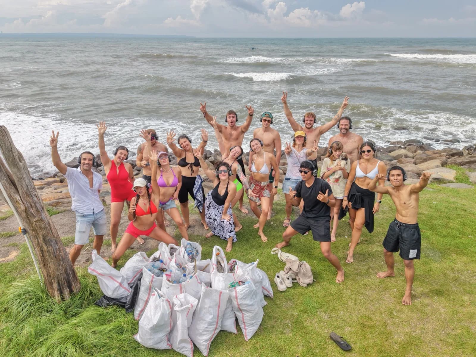 Clifftop crew, bags full, hands up