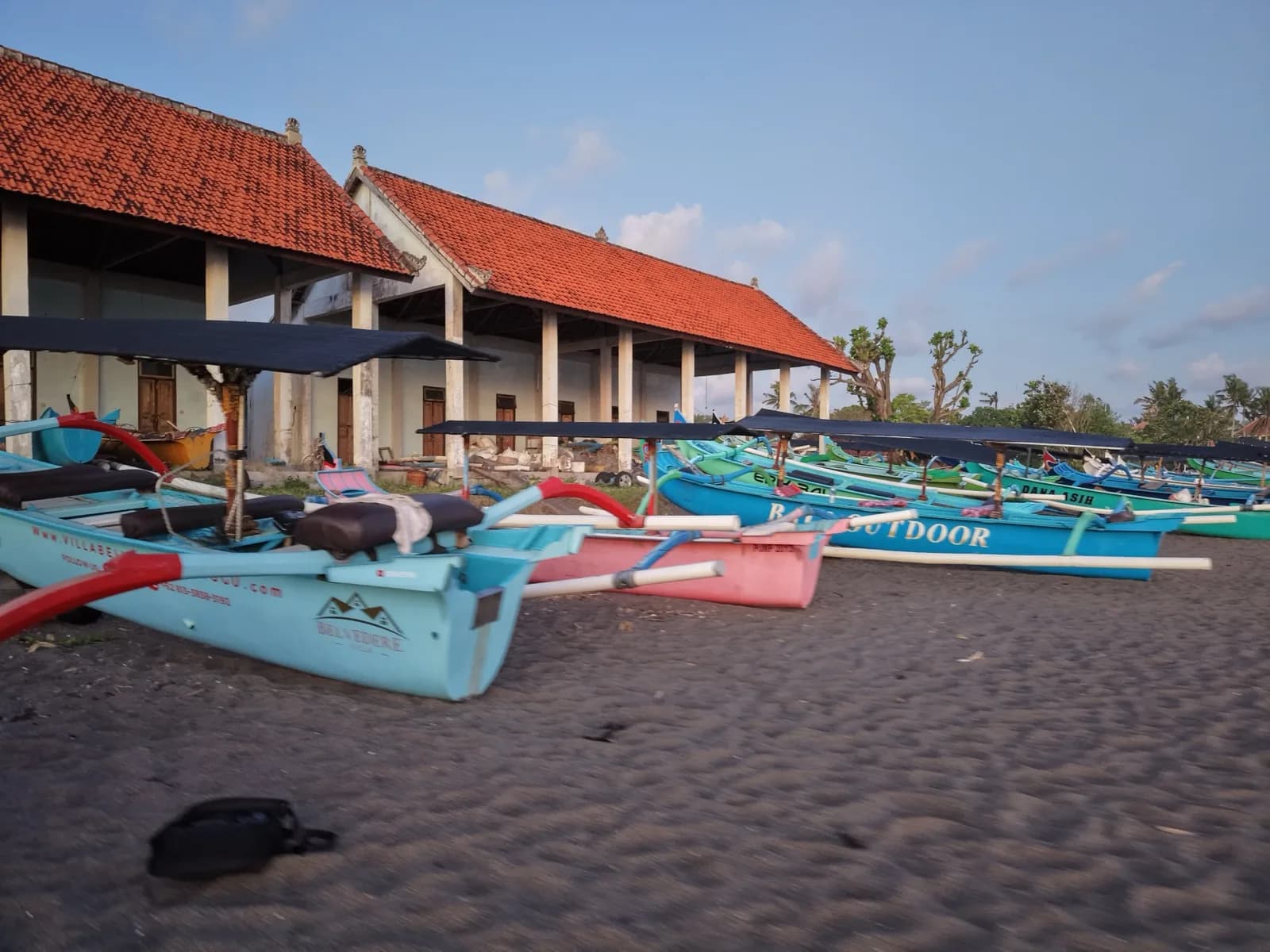 Traditional outrigger boats on the sand